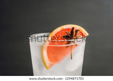 Fresh cocktail with grapefruits on the rustic background. Selective focus. Shallow depth of field.