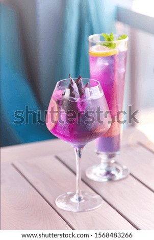 Fresh cocktail. Fresh summer cocktail with fruits and ice cubes. Glass of lemonade soda drink