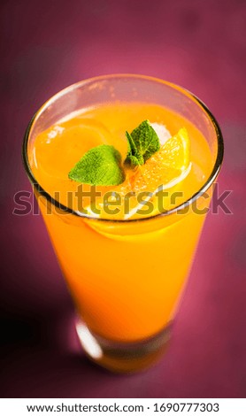 Fresh cocktail with vodka and orange juice on the rustic background. Selective focus. Shallow depth of field.