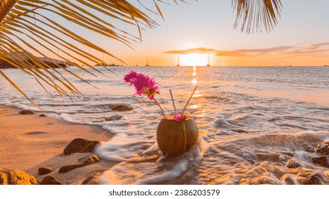 Fresh coconut on the sand at sunset in Martinique, French West Indies. - Powered by Shutterstock