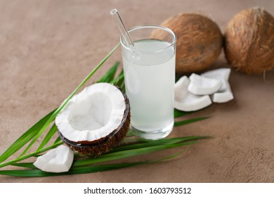 Fresh Coconuts And Coconut Water In Glass With Straw 