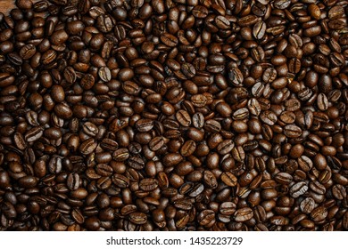 Fresh coffee beans brown seed texture background full wallpaper. - Shutterstock ID 1435223729