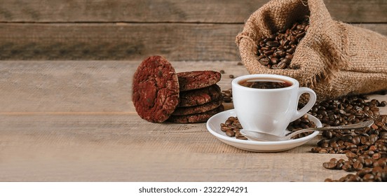 Fresh coffee. A cup of fresh aromatic coffee. Coffee cookies. Grains on a wooden background. Copy space. Banner - Powered by Shutterstock