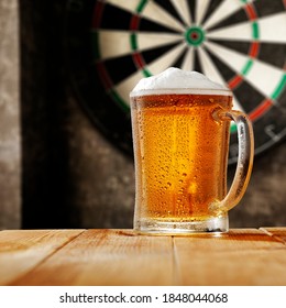 Fresh cold beer and dartboard.  - Powered by Shutterstock