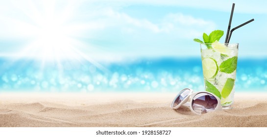 Fresh Cold Cocktail On Tropical Beach With Palms And Bright Sand. Summer Sea Vacation And Travel Concept With Copy Space