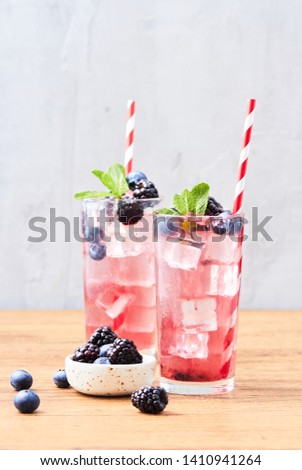 Fresh cold drink with blueberry and blackberry