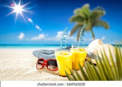 Fresh Cold Drink On Hot Sand And Blurred Landscape Of Beach With Sea.Blue Sky And Sunny Day. 