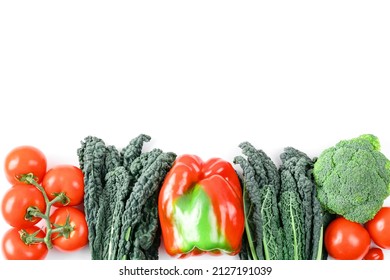 Fresh colorful organic vegetables captured from above, top view, flat lay. Raw healthy food clean eating vegetables source of protein for vegetarians: broccoli, bellpepper, kale, tomato