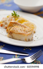 Fresh Cooked Cod Fish With Rice And Lemon