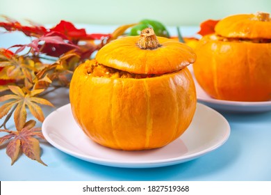 Fresh Cooked Pumpkin Soup Served In A Pumpkin. Stuffed Pumpkin. Autumn Warm And Cozy Food