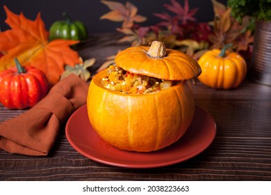 Fresh Cooked Pumpkin Soup Served In A Pumpkin. Stuffed Pumpkin. Autumn Warm And Cozy Food