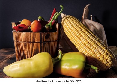 Fresh corncob with chili peppers and tomatoes organic vegetables natural food in bucket, mexican