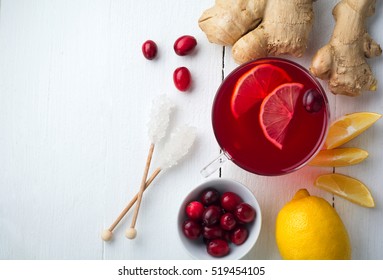 Fresh Cranberry Juice With Lemon, Berry, Ginger And Sugar On A Light Background. Top View. Space For Text. Selective Focus.