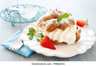 fresh cream puff with whipped cream and strawberries - Powered by Shutterstock