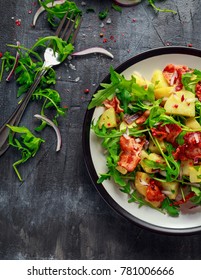 Fresh crispy Bacon, Potato salad with green vegetable on plate - Shutterstock ID 781006666