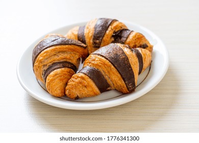 Fresh Croissant With Chocolate On Plate