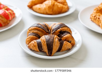 Fresh Croissant With Chocolate On Plate