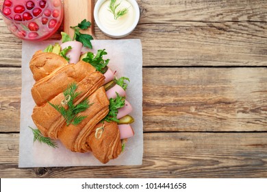 Fresh Croissant Sandwich With Ham, Cheese And Salad Leaf.Top View.