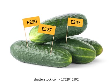 Fresh Cucumbers With E Numbers On White Background. Harmful Food Additives 