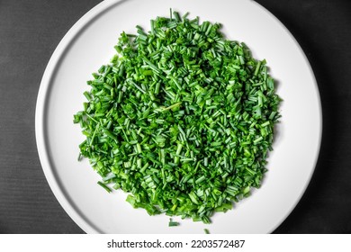 Fresh Cut Chives On A White Plate