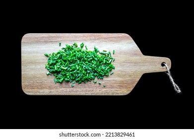 Fresh Cut Chives On A Wooden Cutting Board