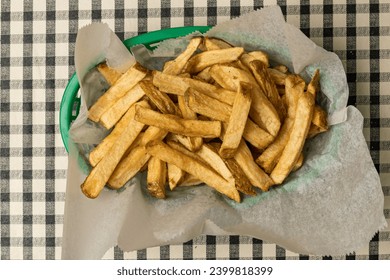 Fresh cut french fries in a basket - Powered by Shutterstock