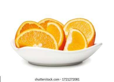 Fresh cut orange fruits on a plate macro photo, isolated on white background