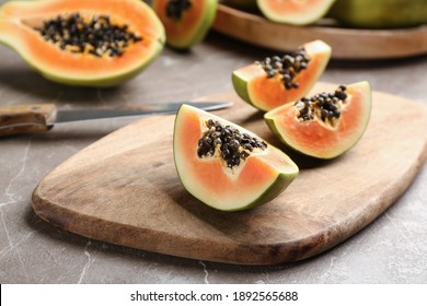 Fresh Cut Papaya On Grey Table. Exotic Fruit