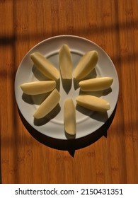 Fresh Cut Potatoes On A Big White Plate