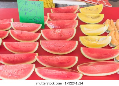 Fresh Cut Of Yellow And Red Watermelon Slice Wrapped In Cling Film At Street Market In Singapore. Summer Tropical Fruit In Plastic Wrap For Convenience To-go Take Away Healthy Snacks