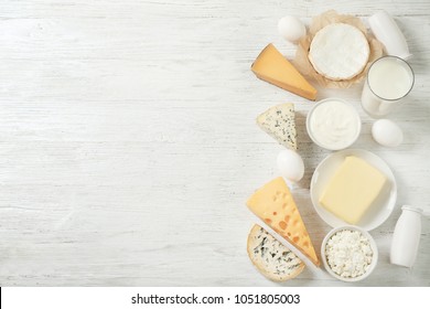 Fresh Dairy Products And Eggs On Wooden Background