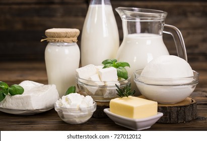 Fresh dairy products on the wooden table  - Shutterstock ID 727012012