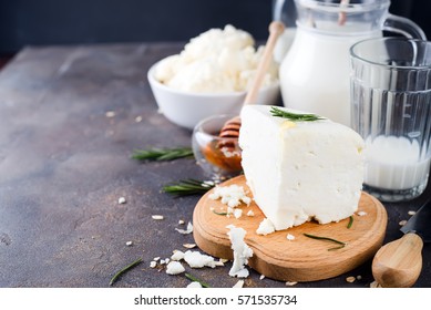 Fresh Dairy Products With Rosemary And Honey On A Dark Stone Background,