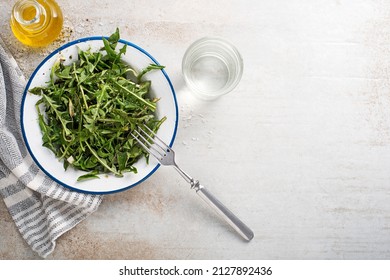 Fresh Dandelion Salad With Dressing. Healthy Spring Food Meal