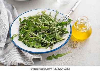 Fresh Dandelion Salad With Dressing. Healthy Spring Food Meal