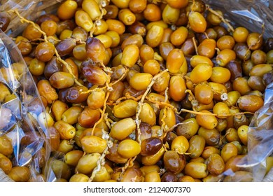 Fresh Date Palms In The Basket. Fresh Date Palms On The Market Stall. Group Of Fresh Date Palms. Ramadan Food Fresh Date