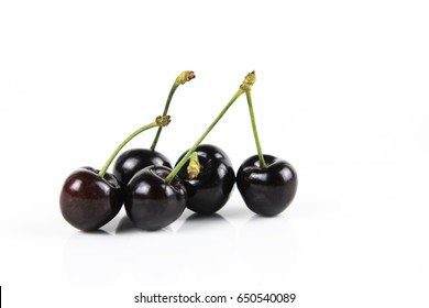 Fresh Delicious Dark Juicy  Red Cherry Fruits   Isolated On A White Background
