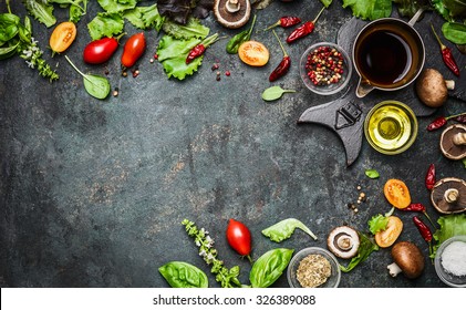 Fresh delicious ingredients for healthy cooking or salad making on rustic background, top view, banner. Diet or vegetarian food concept.