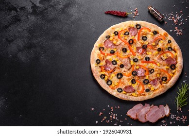 Fresh Delicious Pizza Made In A Hearth Oven With Olives, Chili Pepper And Ham. Mediterranean Cuisine