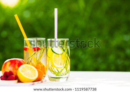 Similar – Infused fruit water cocktails and woman drinking green smoothie