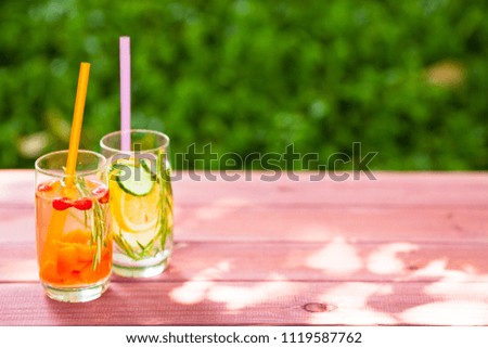 Similar – Infused fruit water cocktails and woman drinking green smoothie