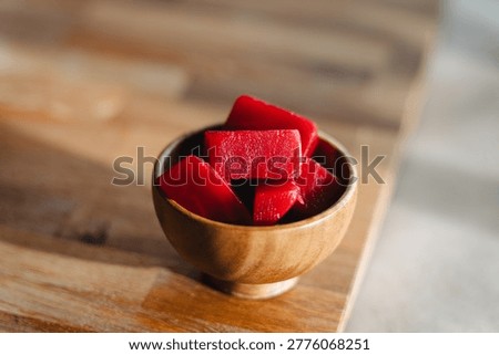 Fresh diced beetroot cubes in a small wooden bowl