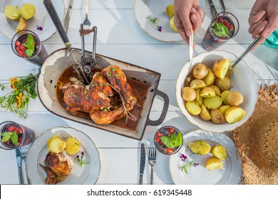 Fresh dinner with potatoes and chicken served in the countryside - Powered by Shutterstock