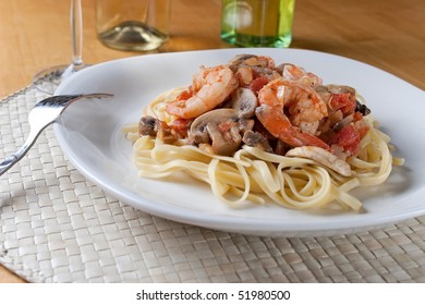 A Fresh Dish Of Shrimp Scampi Over Linguine Pasta.