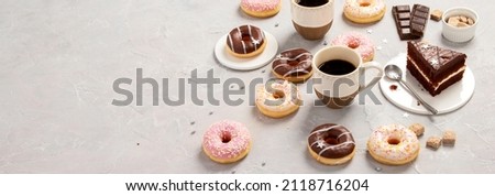 fresh donut with coffee on grey background, panorama, banner