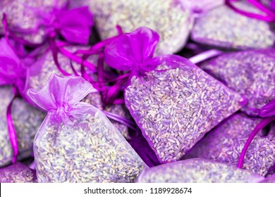 Fresh Dried Lavender Scented Sachets in Small Purple Organza Bags. Selective focus.