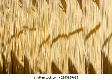 Fresh Dried noodles on drying rack. Outdoor Chinese Traditional Local Homemade Noodle Factory. Yellow pasta Or egg noodles background texture pattern. Instant  Mee Sua Chinese noodles Handmade. - Powered by Shutterstock