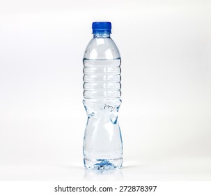 The fresh drink water bottle with small water condense drop inside bottle head on white background