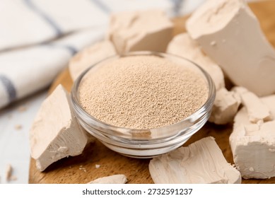 Fresh and dry yeast on table, closeup