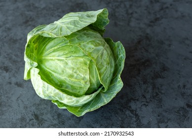 Fresh early cabbage on a dark background - Shutterstock ID 2170932543